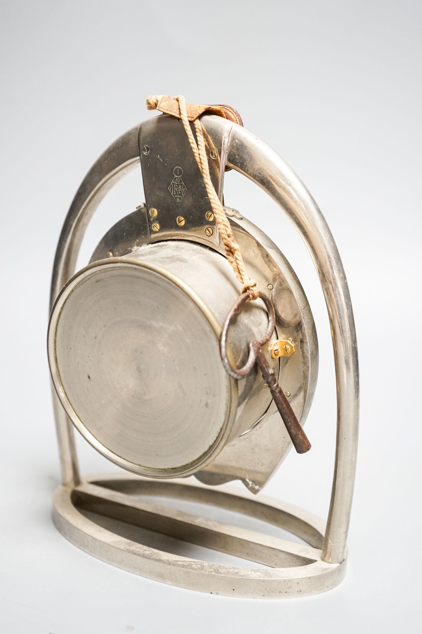 A Victorian patent horseshoe and stirrup mantel clock, French drum movement, the case with registration lozenge mark, with key. 20cm